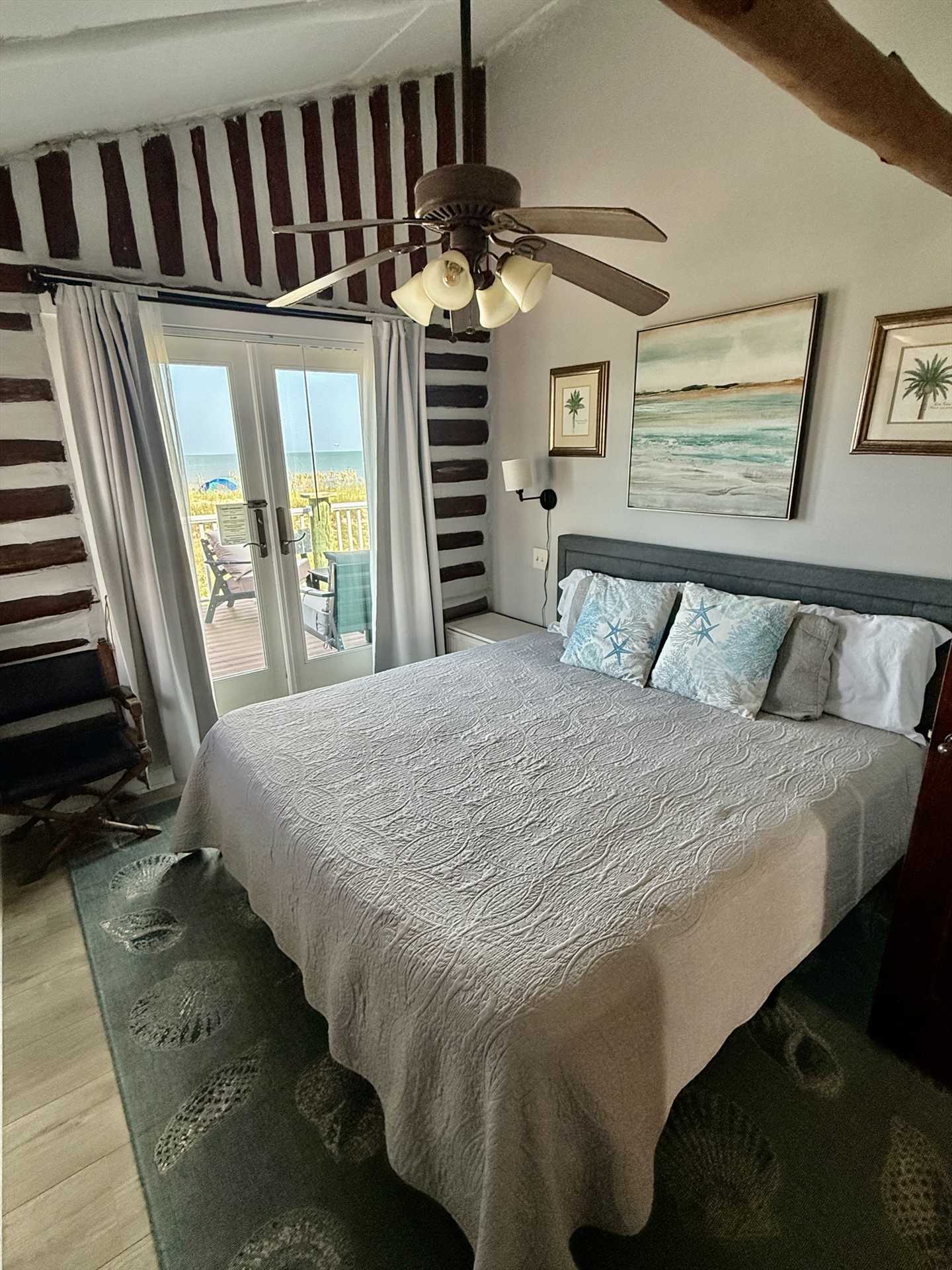 Upstairs King bedroom with patio doors leading to deck. Fabu